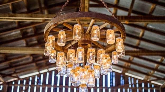 DIY Lighting Ideas and Cool DIY Light Projects for the Home. Chandeliers, lamps, awesome pendants and creative hanging fixtures,  complete with tutorials with instructions | Wagon Wheel Mason Jar Chandelier | http://diyjoy.com/diy-projects-lighting-ideas