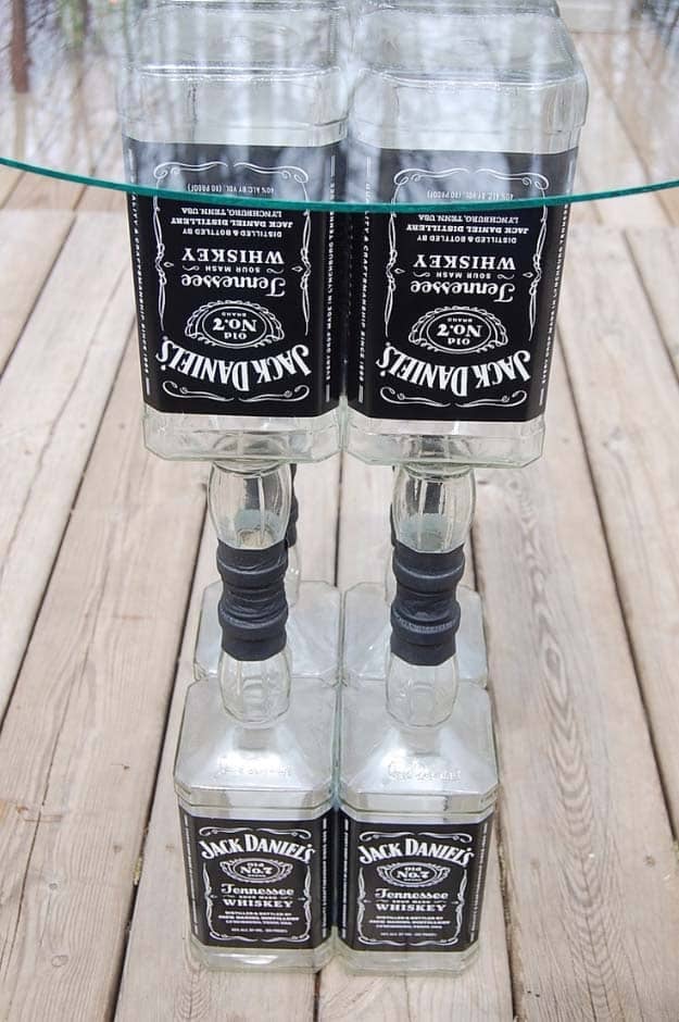 Fun DIY Ideas Made With Jack Daniels - Recipes, Projects and Crafts With The Bottle, Everything From Lamps and Decorations to Fudge and Cupcakes | Upcycled Jack Daniels Liquor Bottle Table Idea #diy #jackdaniels #recipes #crafts