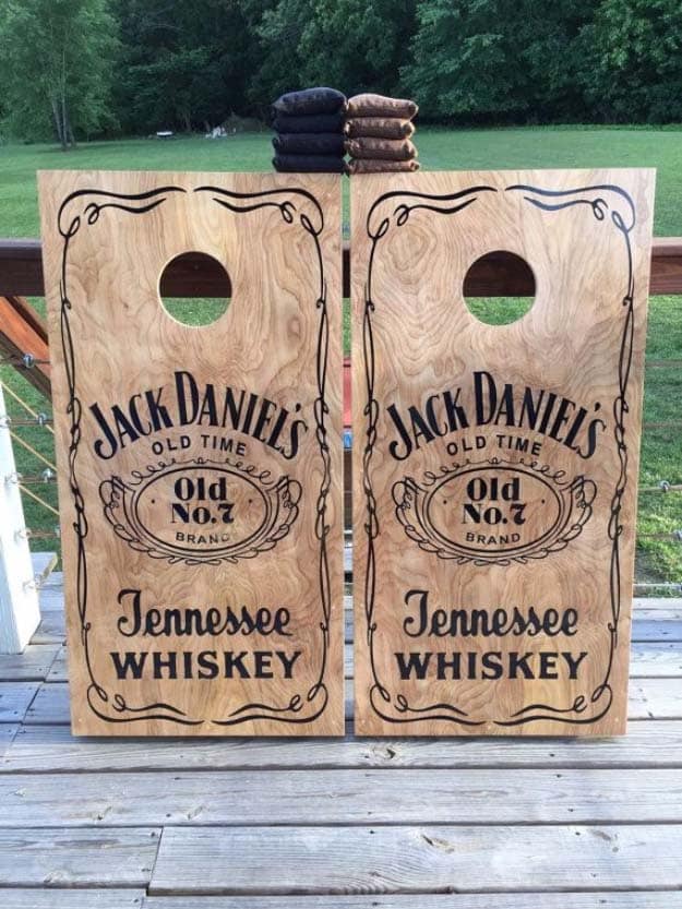 Fun DIY Ideas Made With Jack Daniels - Recipes, Projects and Crafts With The Bottle, Everything From Lamps and Decorations to Fudge and Cupcakes | Jack Daniels Inspired Stenciled Corn Hole Boards #diy #jackdaniels #recipes #crafts