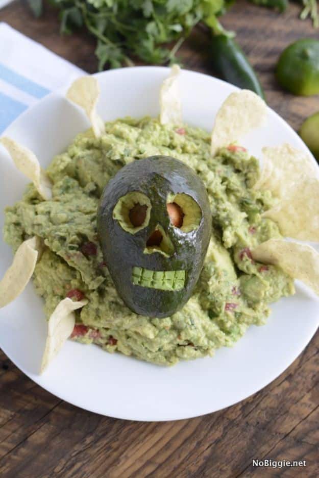 Best Halloween Party Snacks - Holy Skull-y Guacamole - Healthy Ideas for Kids for School, Teens and Adults - Easy and Quick Recipes and Idea for Dips, Chips, Spooky Cookies and Treats - Appetizers and Finger Foods Made With Vegetables, No Candy, Cheap Food, Scary DIY Party Foods With Step by Step Tutorials #halloween #halloweenrecipes #halloweenparty