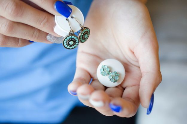 Packing Tips for Travel - Keep A Pair Of Earrings Together With A Button - Easy Ideas for Packing a Suitcase To Maximize Space - Tricks and Hacks for Folding Clothes, Storing Toiletries, Shampoo and Makeup - Keep Clothing Wrinkle Free in Your Bag http://diyjoy.com/packing-tips-travel