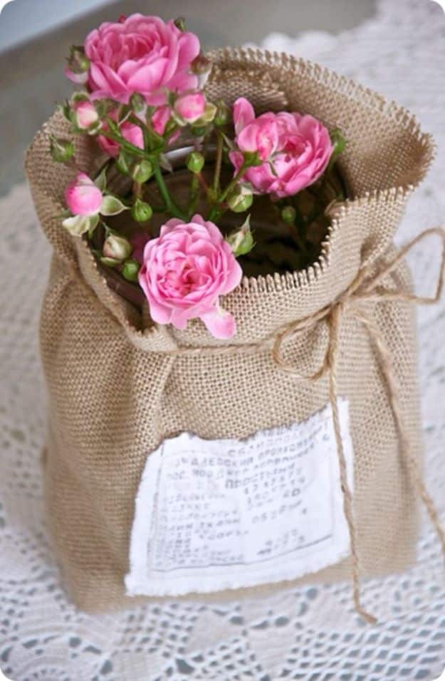 DIY Burlap Ideas - Flowers Wrapped In Burlap - Burlap Furniture, Home Decor and Crafts - Banners and Buntings, Wall Art, Ottoman from Coffee Sacks, Wreath, Centerpieces and Table Runner - Kitchen, Bedroom, Living Room, Bathroom Ideas - Shabby Chic Craft Projects and DIY Wedding Decor http://diyjoy.com/diy-burlap-decor-ideas