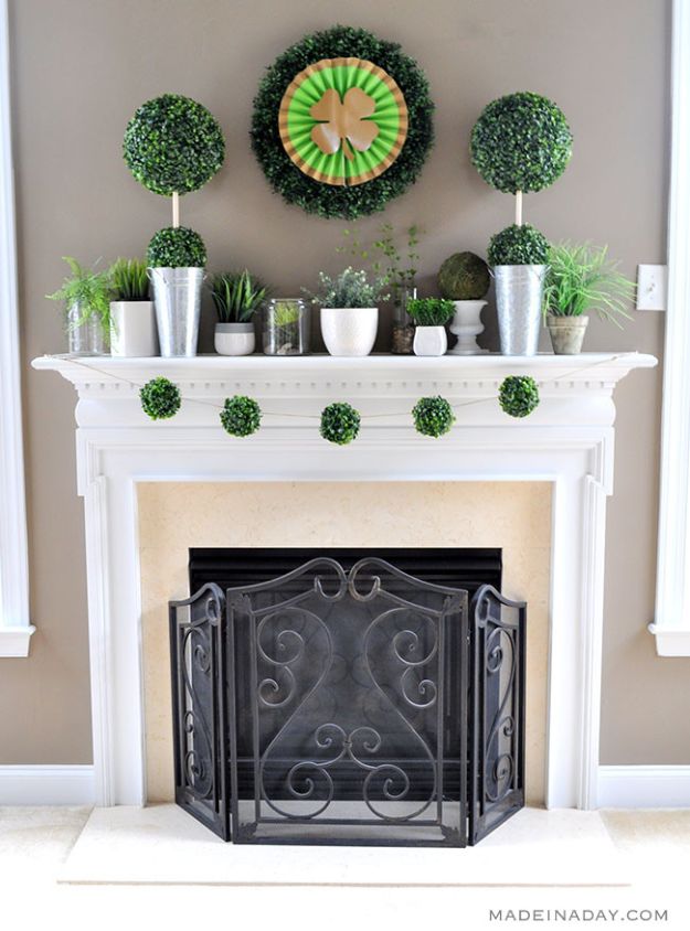 St Patricks Day Decor Ideas - Boxwood Topiaries Garland St Patricks Day Mantle - DIY St. Patrick's Day Party Decorations and Home Decor Crafts - Projects for Walls, Hanging Banners, Wreaths, Tabletop Centerpieces and Party Favors - Green Shamrocks, Leprechauns and Cute and Easy Do It Yourself Decor For Parties - Cheap Dollar Store Ideas for Those On A Budget http://diyjoy.com/diy-st-patricks-day-decor