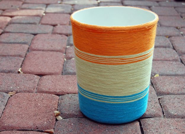 DIY Trash Cans - Yarn Wrapped Trash Can DIY - Easy Do It Yourself Projects to Make Cute, Decorative Trash Cans for Bathroom, Kitchen and Bedroom - Trash Can Makeover, Hidden Kitchen Storage With Pull Out Cabinet - Lids, Liners and Painted Decor Ideas for Updating the Bin #diykitchen #diybath #trashcans #diy #diyideas #diyjoy http://diyjoy.com/diy-trash-cans