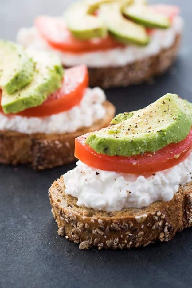 Best Recipes for the Cheese Lover - Avocado Toast With Cottage Cheese and Tomatoes - Easy Recipe Ideas With Cheese - Homemade Appetizers, Dips, Dinners, Snacks, Pasta Dishes, Healthy Lunches and Soups Made With Your Favorite Cheeses - Ricotta, Cheddar, Swiss, Parmesan, Goat Chevre, Mozzarella and Feta Ideas - Grilled, Healthy, Vegan and Vegetarian #cheeserecipes #recipes #recipeideas #cheese #cheeserecipe 
