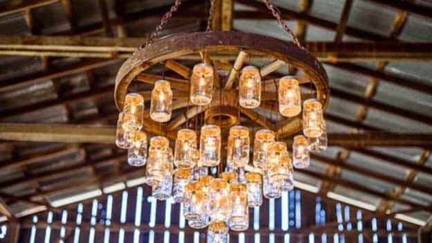 DIY Chandelier Ideas and Project Tutorials - DIY Lighting Ideas and Cool DIY Light Projects for the Home. Chandeliers, lamps, awesome pendants and creative hanging fixtures, complete with tutorials with instructions | Wagon Wheel Mason Jar Chandelier | http://diyjoy.com/diy-projects-lighting-ideas - Easy Makeover Tips, Rustic Pipe, Crystal, Rustic, Mason Jar, Beads. Bedroom, Outdoor and Wedding Girls Room Lighting Ideas With Step by Step Instructions 