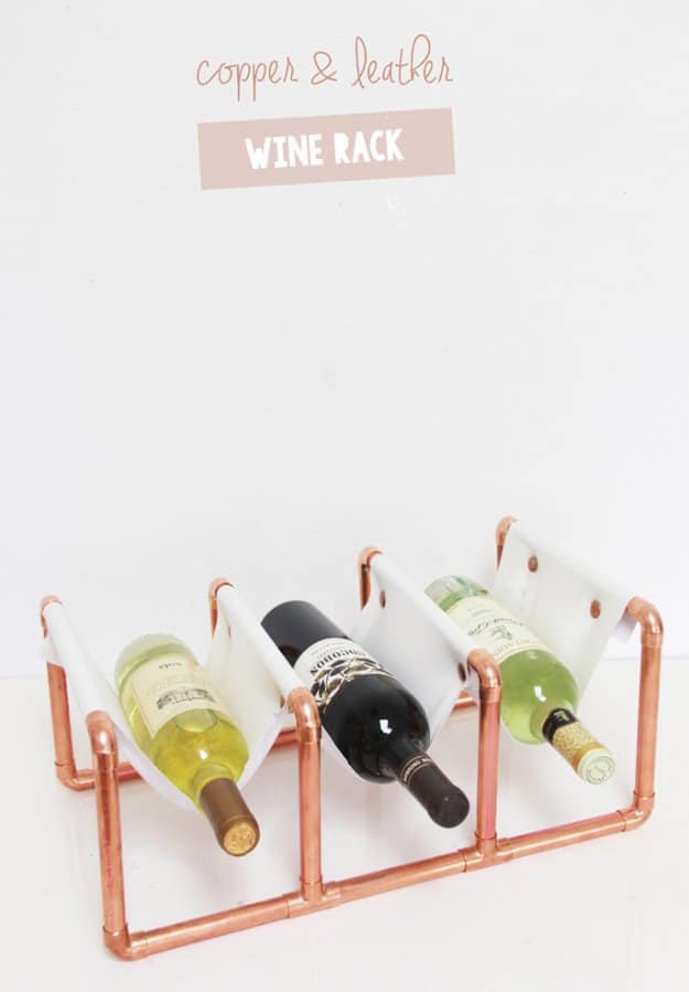 DIY Kitchen Decor Ideas - DIY Copper Pipe and Leather Wine Rack - Creative Furniture Projects, Accessories, Countertop Ideas, Wall Art, Storage, Utensils, Towels and Rustic Furnishings http://diyjoy.com/diy-kitchen-decor-ideas