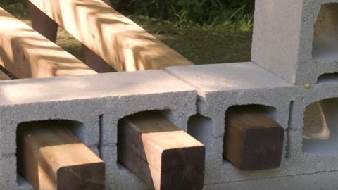 She Puts These Wood Posts Through These Cinder Blocks And Watch What She Does Next! | DIY Joy Projects and Crafts Ideas