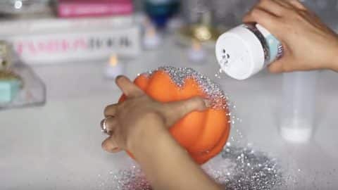 Dollar Store Halloween: Glittery Pumpkin Candle Holder | DIY Joy Projects and Crafts Ideas