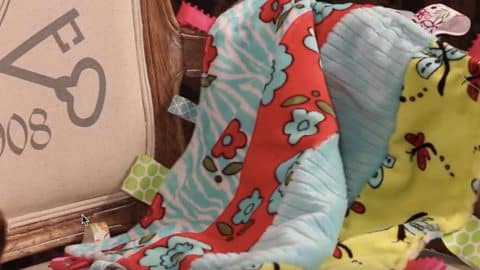 She Makes An Adorable Busy Tag Baby Blanket For A Special Baby Gift | DIY Joy Projects and Crafts Ideas