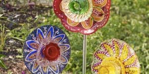 She Shows Us How To Make This Fabulous Yard Art Out Of Old Plates!
