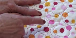 Watch How She Does This Quick And Easy Quilt Stitch To Give Her Quilt A Customized Look!
