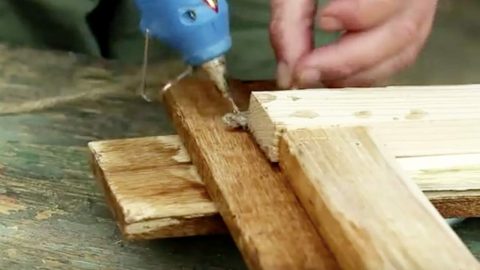 He Nails Pallets, Wraps And Hot Glues Twine. You’ll Always Have A Place For This Item! | DIY Joy Projects and Crafts Ideas