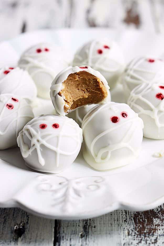 Best Halloween Party Snacks - Pumpkin Cheesecake Truffle Mummies - Healthy Ideas for Kids for School, Teens and Adults - Easy and Quick Recipes and Idea for Dips, Chips, Spooky Cookies and Treats - Appetizers and Finger Foods Made With Vegetables, No Candy, Cheap Food, Scary DIY Party Foods With Step by Step Tutorials #halloween #halloweenrecipes #halloweenparty