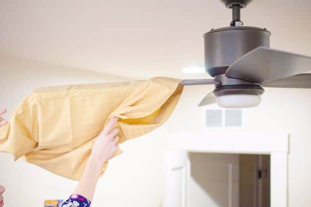 Cleaning Tips and Tricks - Use A Pillowcase To Dust A Ceiling Fan - Best Cleaning Hacks, Recipes and Tutorials - Daily Ways to Clean For Kitchen, For Couches, Bathroom, Bedroom, Laundry, Floors, Furniture, Windows, Cleaners and More for Cleaning Your Home- Quick Ideas for Lazy People - Cool Cleaning Hack Tutorial 