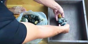 He Makes A Pallet Wood Box And Fills It With River Stones For A Clever Purpose!