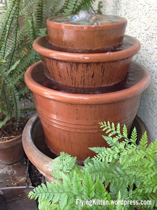DIY Fountains -Make A Clay Pot Fountain - Easy Ways to Make A Fountain in the Backyard - Do It Yourself Projects for the Garden - DIY Home Improvement on a Budget - Step by Step DIY Tutorials With Instructions http://diyjoy.com/diy-fountains