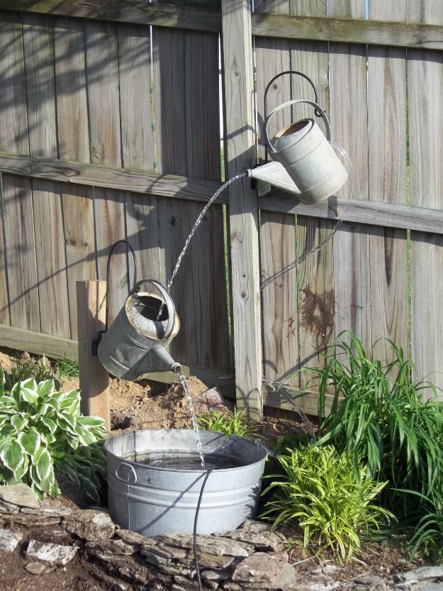 DIY Fountains - Watering Can Fountain - Easy Ways to Make A Fountain in the Backyard - Do It Yourself Projects for the Garden - DIY Home Improvement on a Budget - Step by Step DIY Tutorials With Instructions http://diyjoy.com/diy-fountains