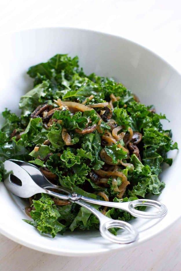 Best Kale Recipes - Warm Kale Salad With Caramelized Onions & Mushrooms - Healthy Green Vegetable Cooking for Salads, Soup, Lunches, Stir Fry and Dinner - Kale Chips. Salad, Shredded, Cooked, Fresh and Sauteed Kale - Vegan, Vegetarian, Keto, Low Carb and Lowfat Recipe Ideas #kale #kalerecipes #vegetablerecipes #veggies #recipeideas #dinnerideas 