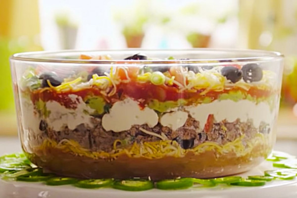 Make this exciting 7 Layer Party Dip with ground beef and refried beans