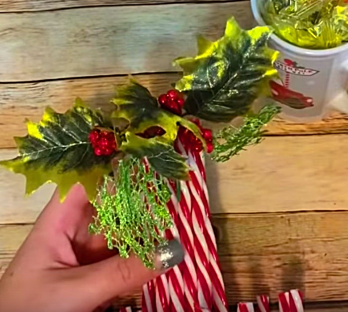 Try this tutorial and Learn to make a cheap DIY Candy Cane Luminary from Dollar Tree