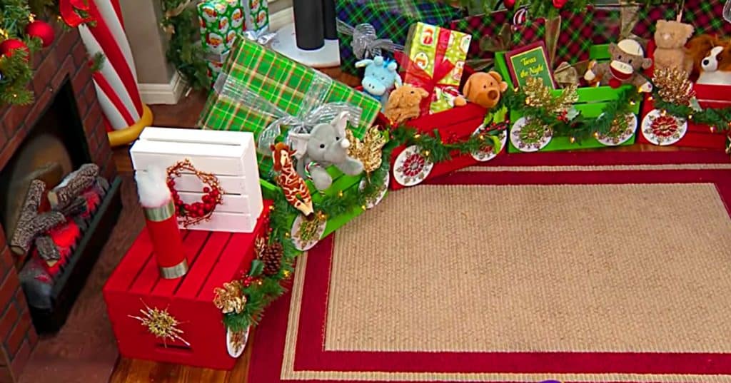 Learn to make a DIY Christmas Crate Train out of craft crates and spray paint