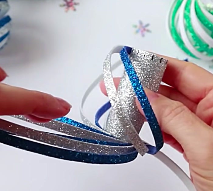 Learn to make these cheap easy DIY Foam Swirl Christmas ornaments with glitter foam paper and a hot glue gun