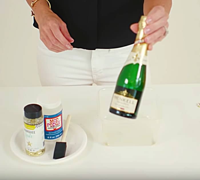 Learn to make easy cheap DIY Glitter Champagne Bottles