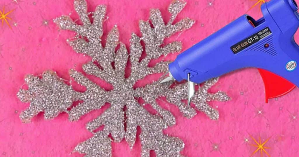 Learn to make a DIY Glue Gun Snowflake With Glitter