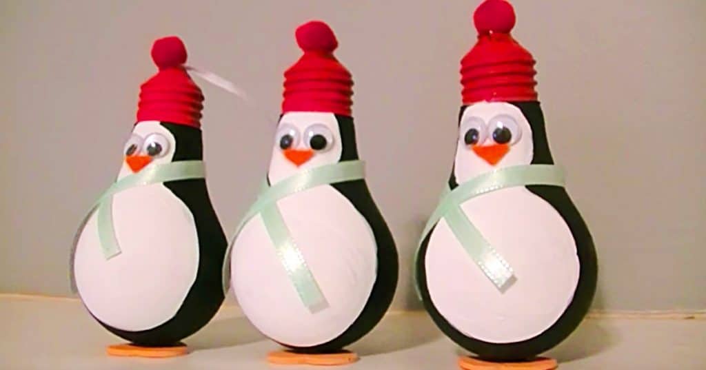 Learn to make this DIY Penguin Light Bulb Ornament from an old light bulb and paint