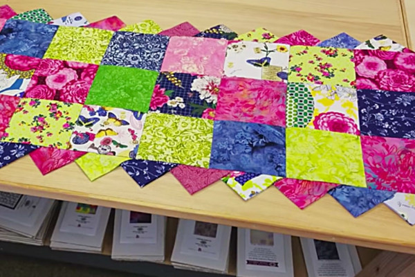 Learn to sew and quilt a prairie points table runner