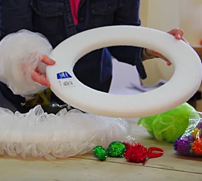 Learn to make a DIY Christmas door wreath out of bath scrubbies