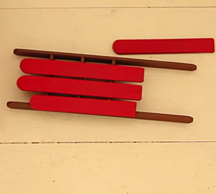 Try making a DIY Sled and Skis Ornament from popsicle sticks and craft paint