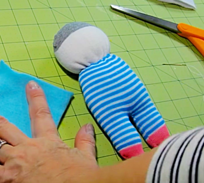 Learn to make a cheap, easy, quick sock doll for Christmas Gifts