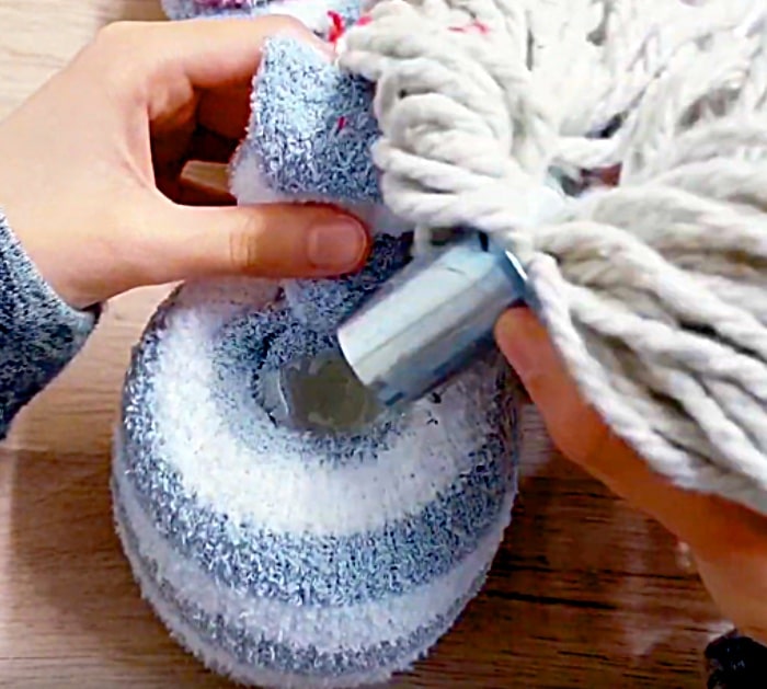 Learn to make a DIY Sock Gnome for Christmas out of rice and Dollar Tree Items