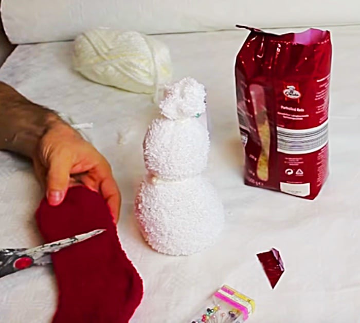 Learn to make this quick easy cheap DIY sock snowman with socks and rice