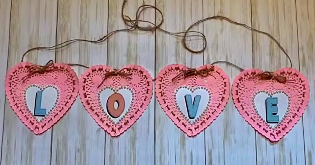 Learn to make a paper heart doily banner using dollar Tree materials