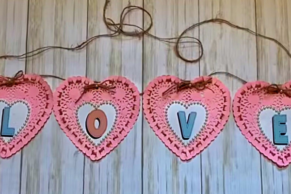 Learn to make a paper heart doily banner using dollar Tree materials