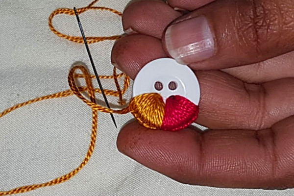 Make hand embroidered buttons.