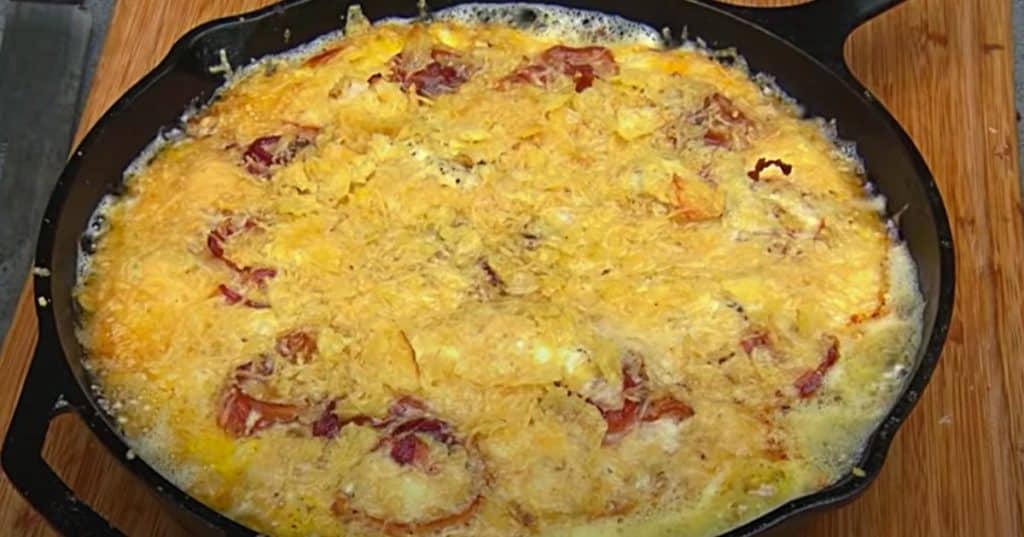 Bacon, egg, potato chip, and cheese pie on the BBQ pit