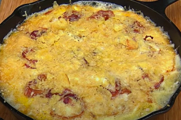 Bacon, egg, potato chip, and cheese pie on the BBQ pit