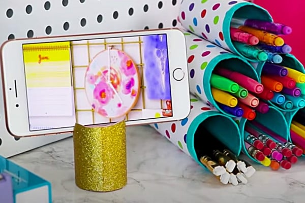 Make a phone holder from an empty toilet paper roll