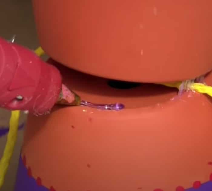 Make flower pot people with clay pots and a glue gun