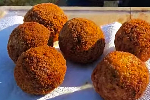 Make scotch eggs in the deep fryer with a propane tank outside