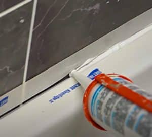 How To Apply Silicone Caulk To Tile Or Bath | DIY Joy