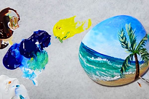 How to paint a beach scene on a rock