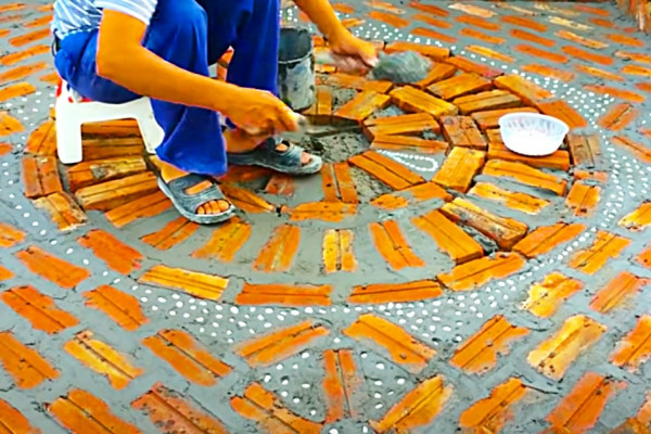 How to build a work of art in the backyard using bricks, cement, and shells