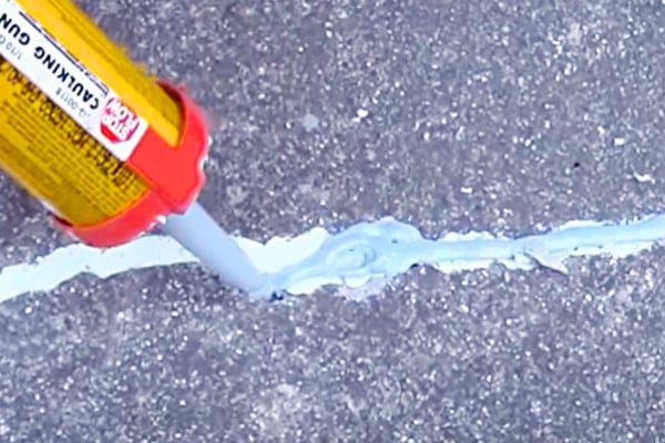 Fix cracks in the cement driveways and sidewalks