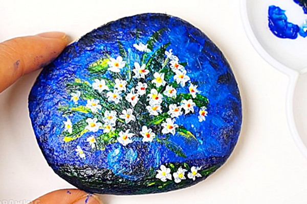 How to paint a still life flower scene on a smooth river rock
