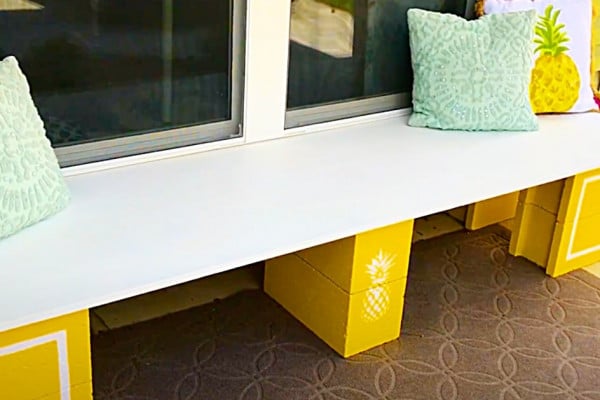 How To Make A DIY Cinder Block Outdoor Bench With Pineapple Accents